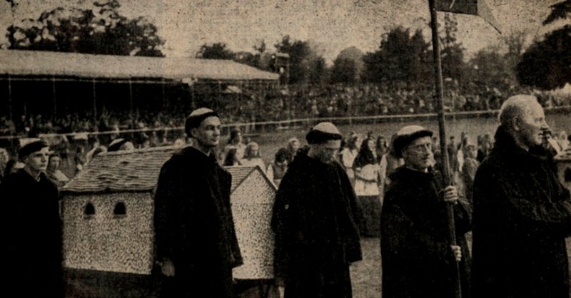 From the local newspaper, monks carrying a model of St Stephen’s Church, with the grandstand in the background